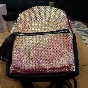 gold iridescent mini backpack.